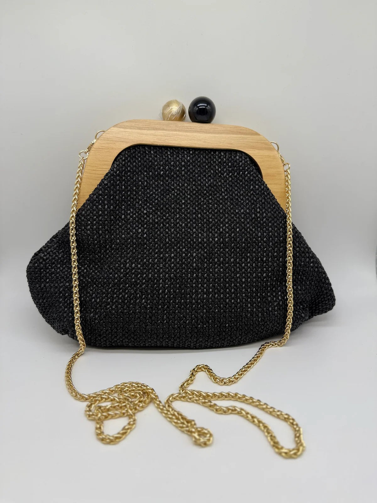 Bolso clutch con cadena